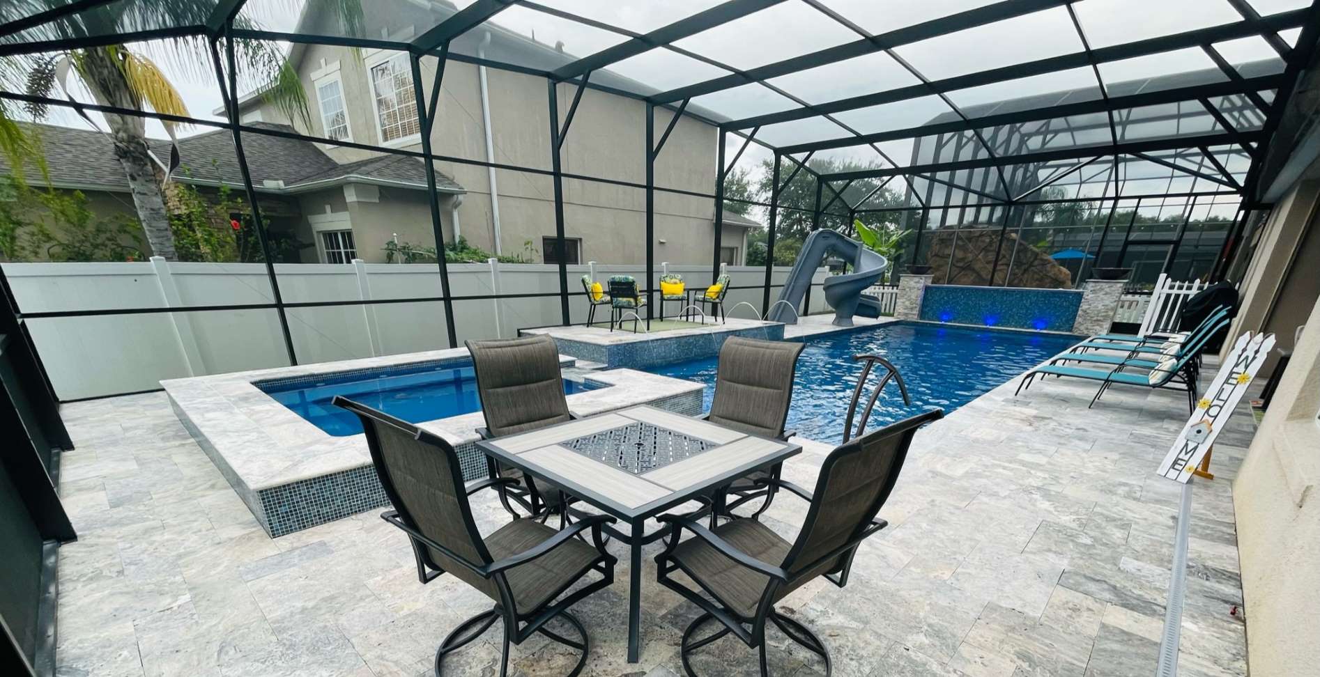 Completed fiberglass pool and deck in a Florida backyard