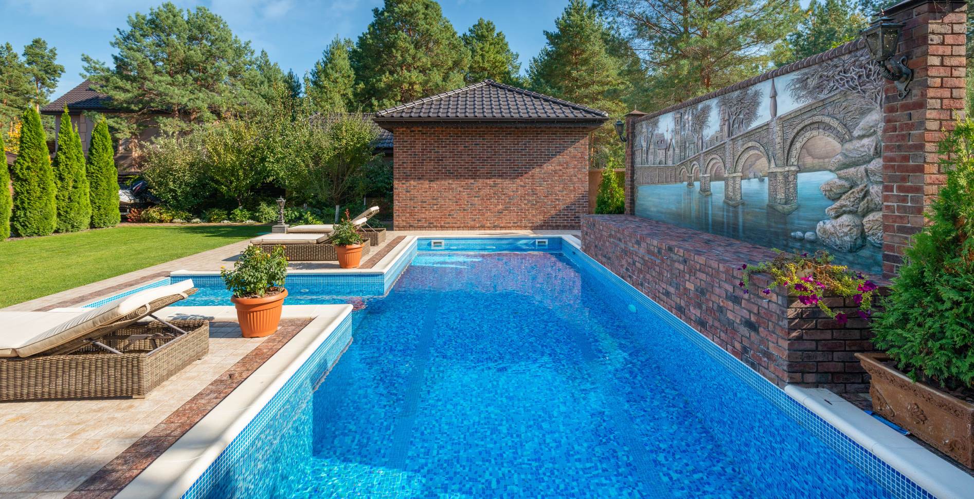 Residential swimming pool beside an outdoor living area
