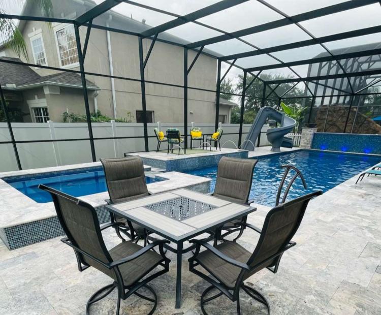 Completed fiberglass pool and deck in a Florida backyard